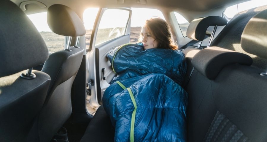 sleeping inside car using sleeping bag